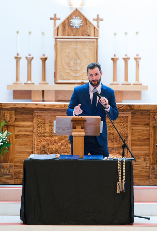 Trip speaking at a Catholic school event